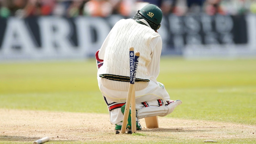 Nathan Lyon slumps after being bowled out