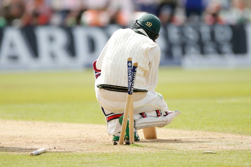 Nathan Lyon slumps after being bowled out