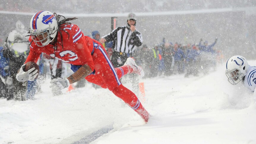 Buffalo Bills' Kelvin Benjamin scores a touchdown in the snow