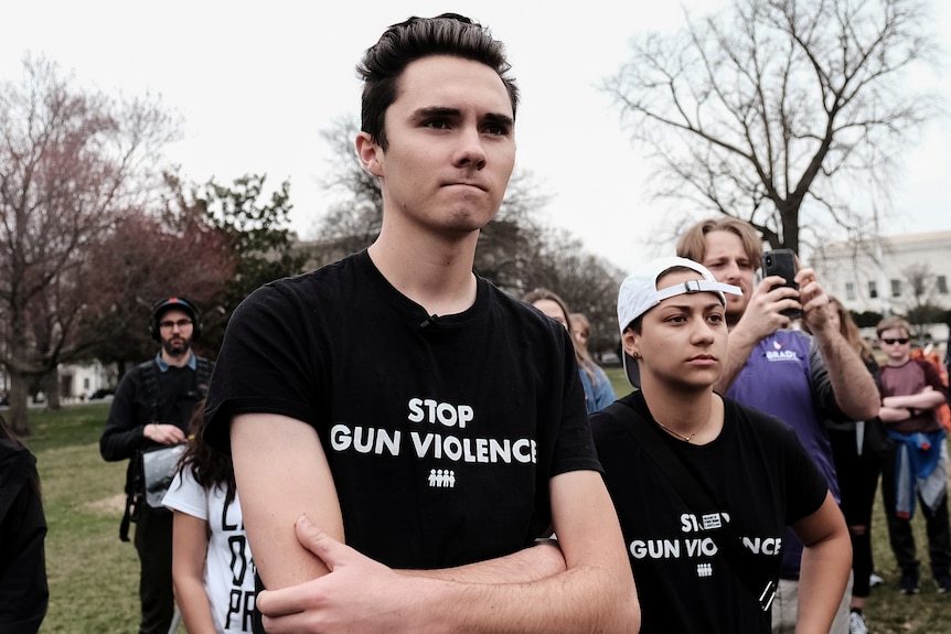Parkland shooting survivors Emma Gonzalez and David Hogg stand together at a protest to end gun violence.