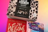 A wheat bag, period products for young girls and a book called Welcome to Your Period.