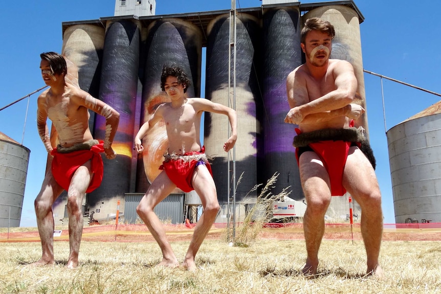 Aboriginal dancers at Sheep Hills where Adnate is painting the silos.