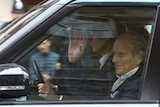 Prince Philip is driven in a car in London