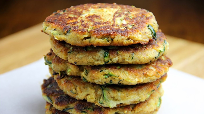 A stack of delicious looking corn and zucchini fritters