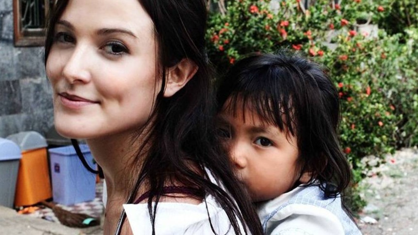 Tara Winkler with a Cambodian child