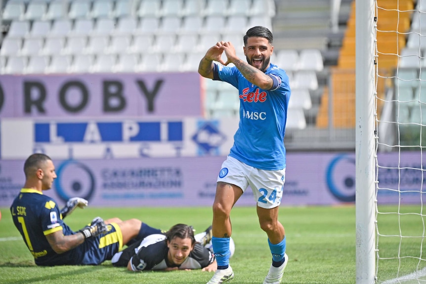 A striker makes heart sign with his fingers as he celebrates a goal in Italy's top football league.