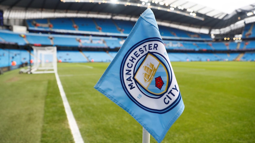 A close-up shot of a corner flag at Manchester City's stadium.