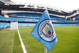 A close-up shot of a corner flag at Manchester City's stadium.