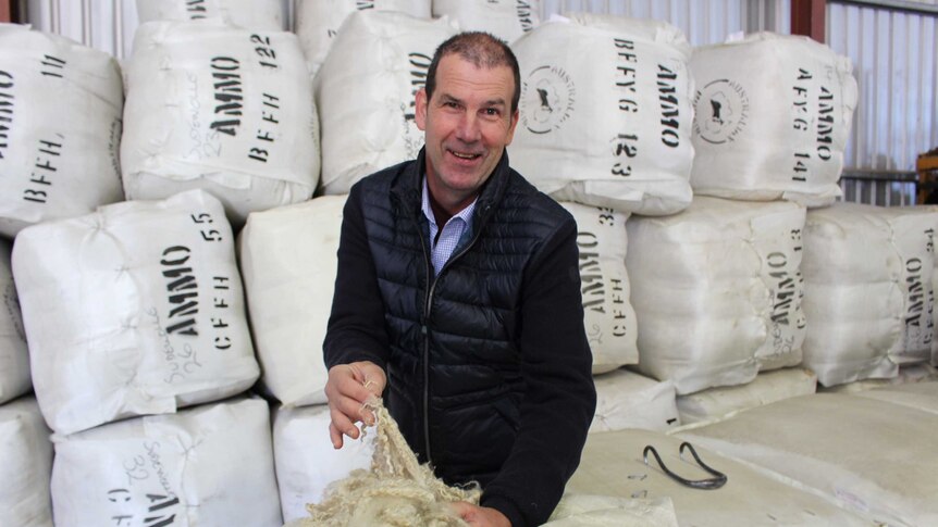Australian Mohair Marketing Organisation warehouse manager Craig Clancy with mohair bales.