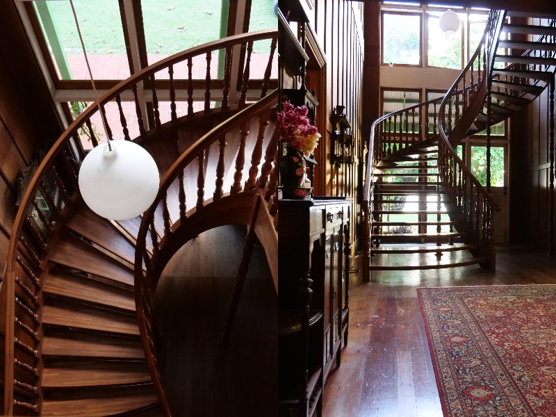 A wooden staircase in an old mansion.