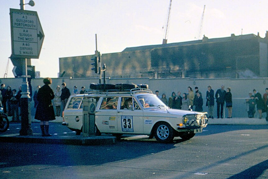 A white Volvo station wagon with the race number 33 on the side