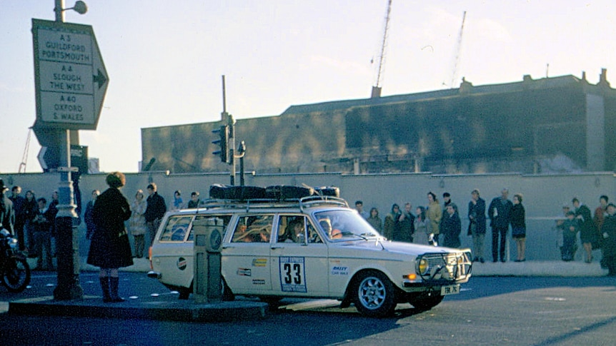 A white Volvo station wagon with the race number 33 on the side