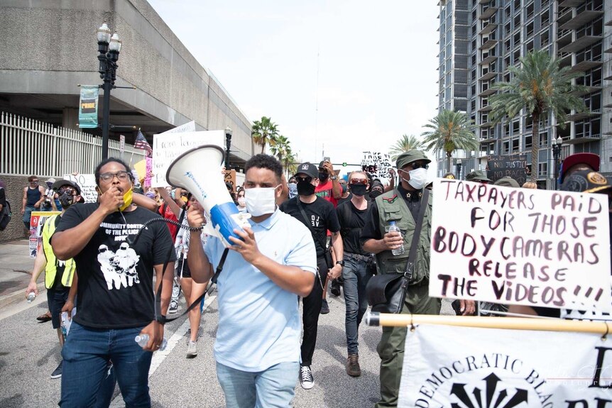 American protest organiser Michael Sampson II (on left) marching in Jacksonville, Florida on Saturday, May 30, 2020.