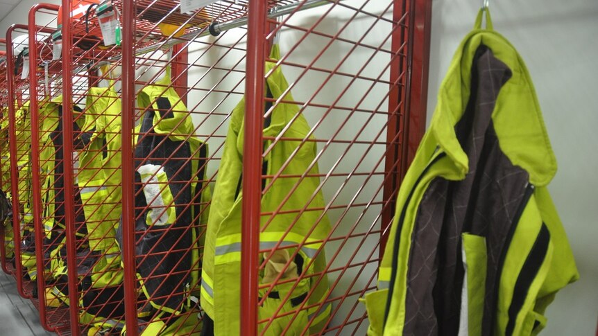 High-vis jackets hang in a row