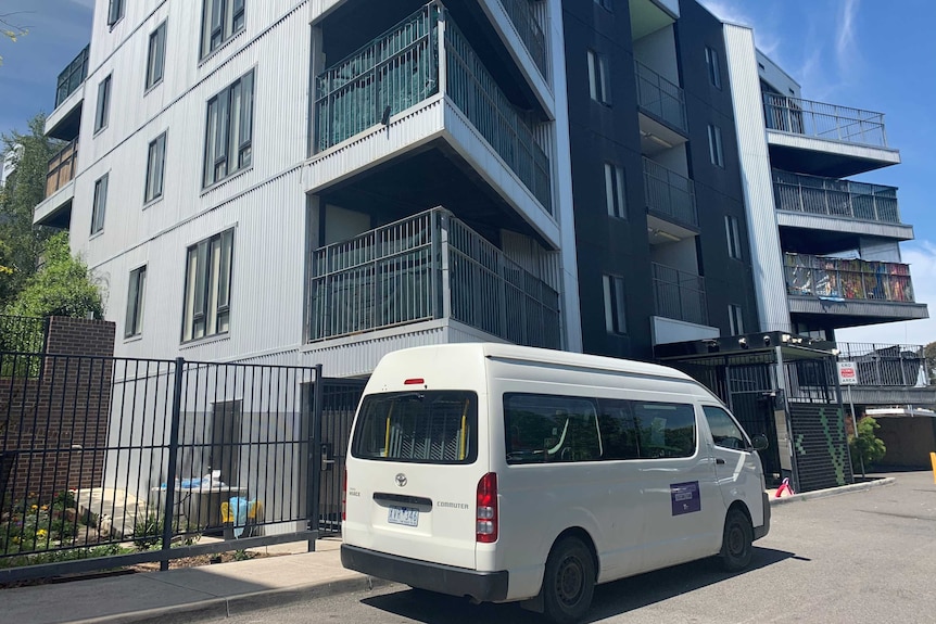 A photo of a community housing block with a van out the front in Broadmeadows.