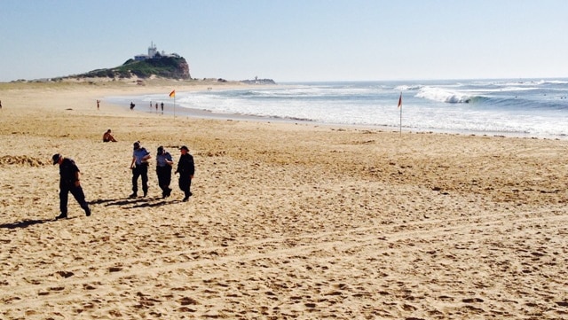 Police spent most of the day searching Nobbys Beach and nearby Foreshore Park for clues.