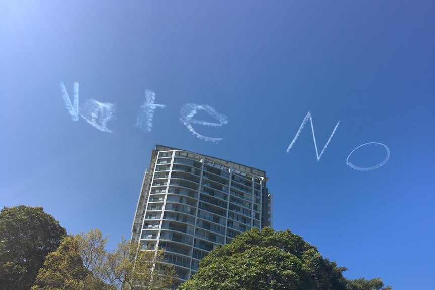 "Vote No" written across the sky.