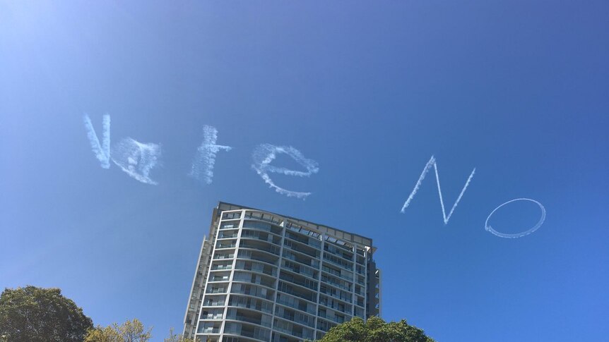 "Vote No" written across the sky.