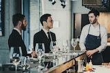 Picture of three men in a restaurant