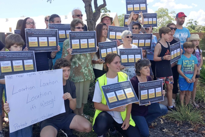 Around 20 Lockridge residents hold placards protesting against the location of the Bennett Brook Disability Justice Centre.