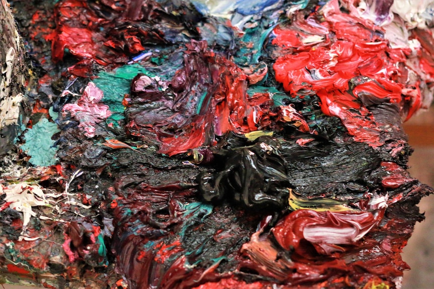 A thick mixture of paints swirled together