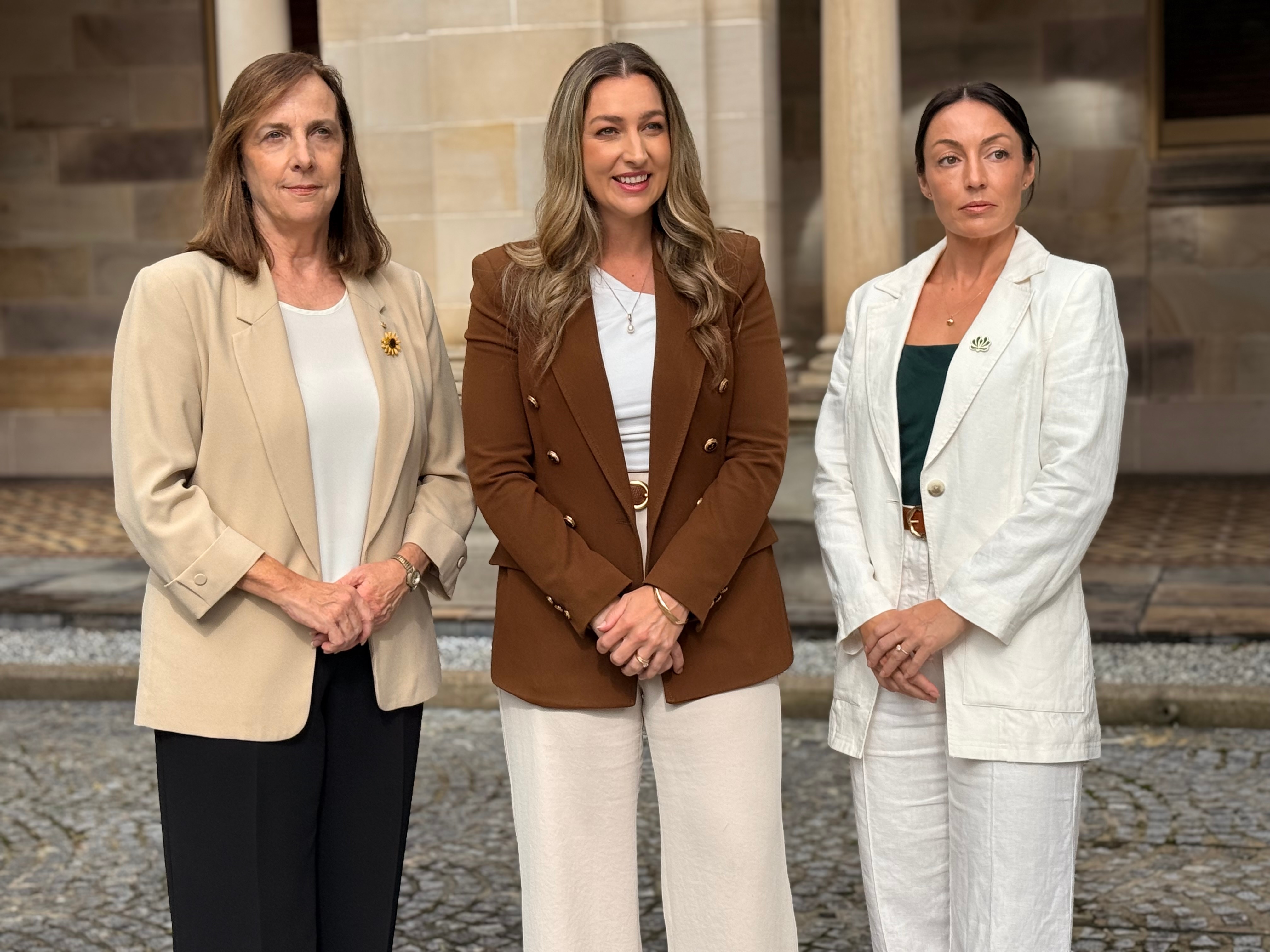 Vanessa Fowler, Laura Gerber and Danielle Carroll standing.