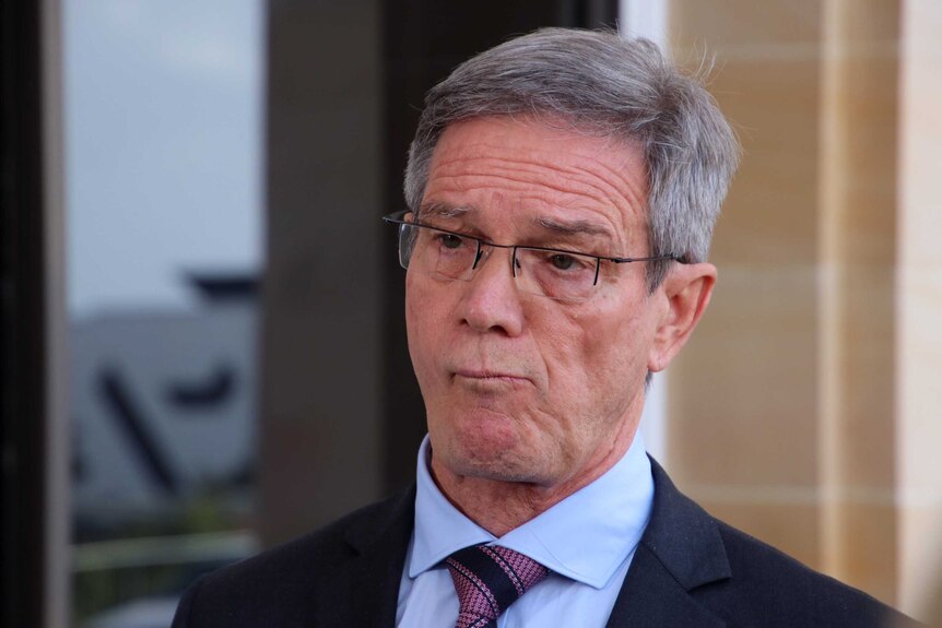 A head and shoulder shot of Mike Nahan outside of the WA Parliament.
