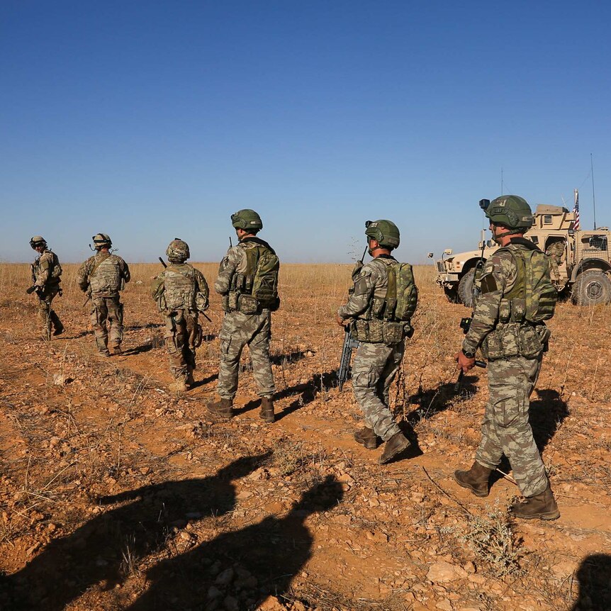 US and Turkish soldiers patrol Manbij, Syria