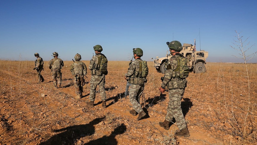 US and Turkish soldiers patrol Manbij, Syria