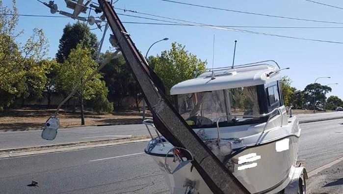 A boat and trailer which crashed into a stobie pole at Walkley Heights and caused extensive damage.