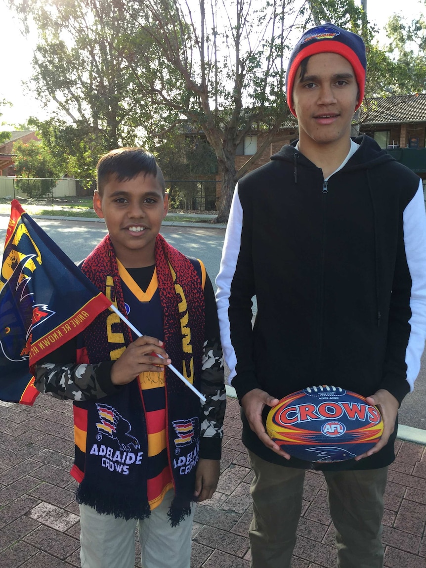 Crows fans Jacquille and Brent Cameron outside Subiaco Oval