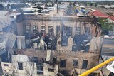 Aerial shot showing three standing walls of historic pub burnt out from the inside