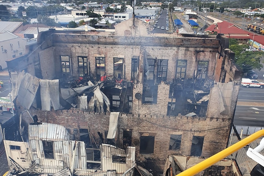 Aerial shot showing three standing walls of historic pub burnt out from the inside