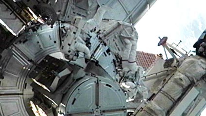 Ron Garan and Mike Fossum exit the ISS Quest airlock to begin their spacewalk