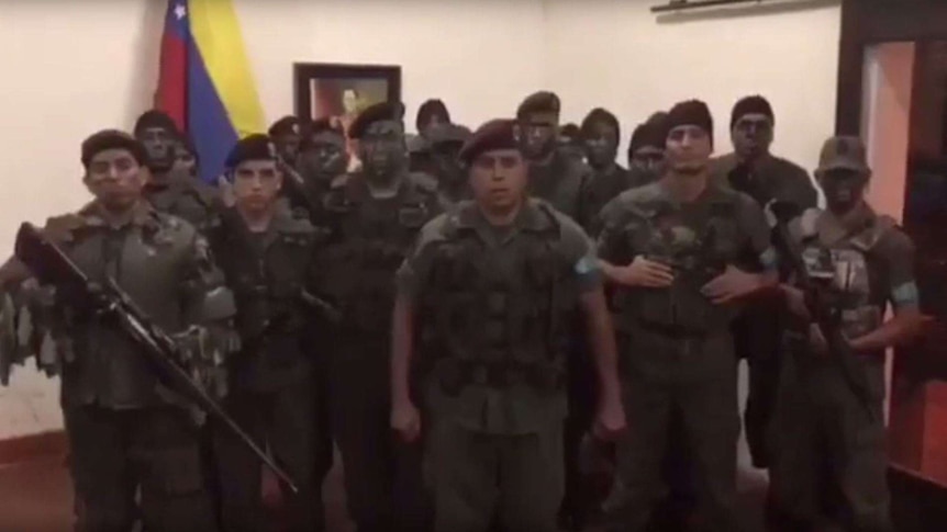 A group of men dressed in military uniforms announcing a rebellion against the Venezuelan government.