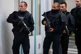 French police secure the area as shots are exchanged in Saint-Denis, France