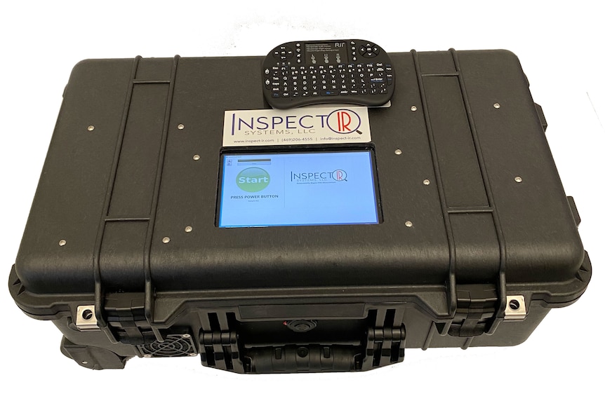 A large black box labelled InspectIR with a handle and display screen