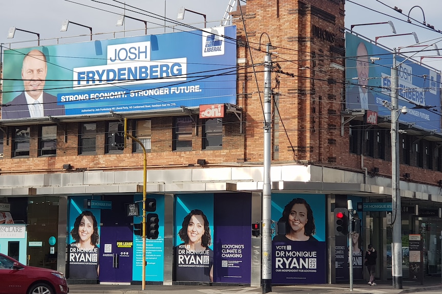 Billboards on the side of a building at Camberwell Junction 