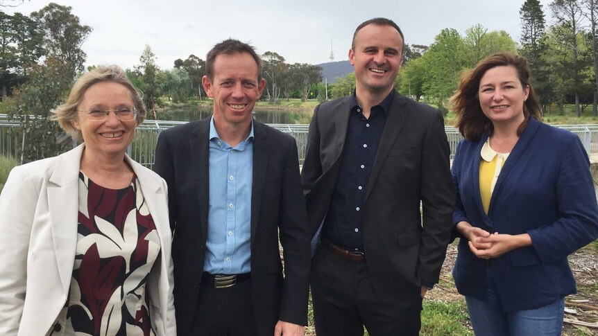 Four MLAs pose for a photo at Lyneham wetlands.