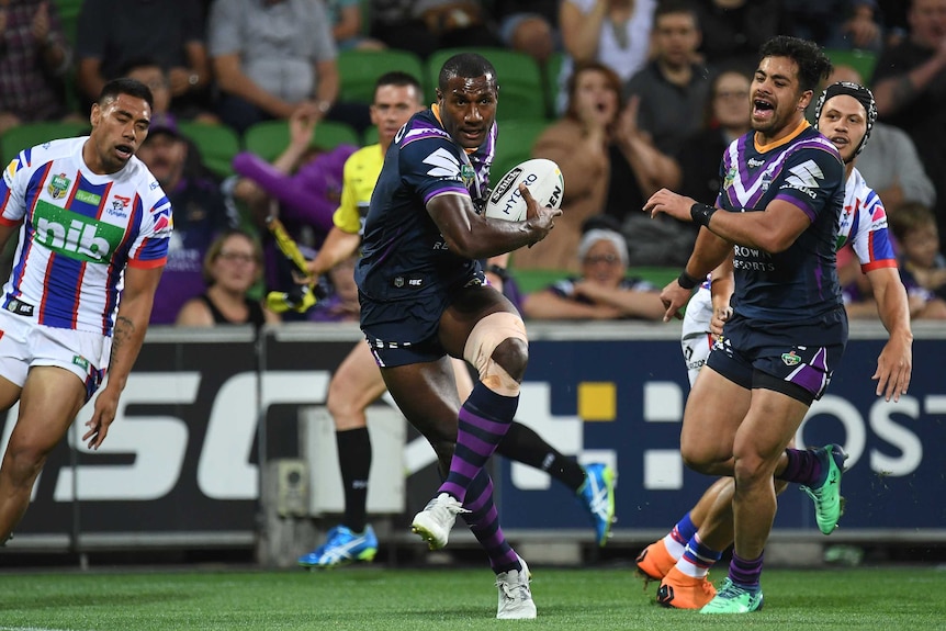 Suliasi Vunivalu of the Storm (2L) is seen moments before scoring a try against Newcastle.