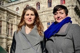 Australian opera singers Nicole Car and Margaret Plummer stand outside Vienna's state opera house.