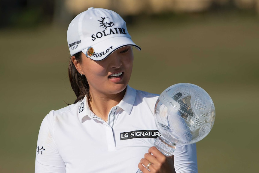 Jin Young Ko with the trophy.