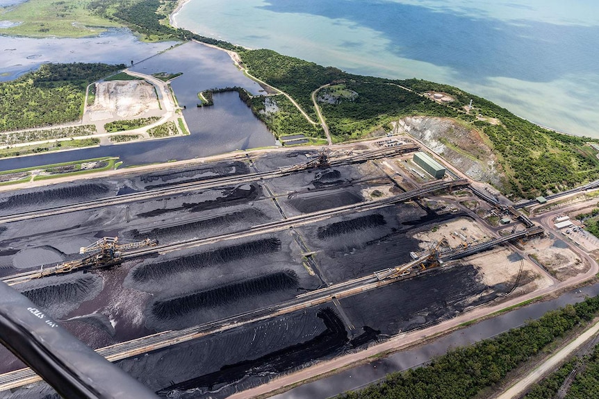Aerial photo of alleged eroded coal stockpiles (foreground), drainage channels and settlement ponds (at back) at Abbot Point.
