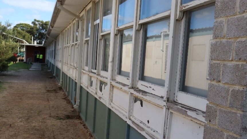 A classroom from the outside, missing lots of paint
