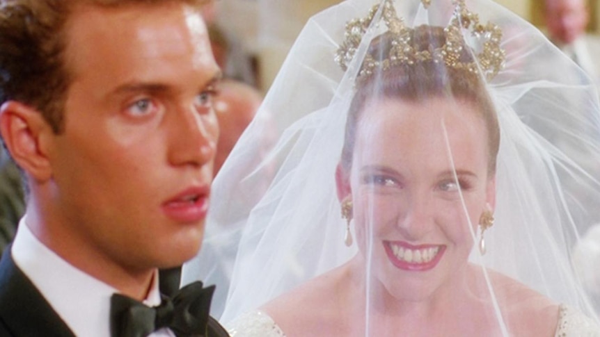 Toni Collette as Muriel Heslop stares excitedly at her husband on her wedding day.