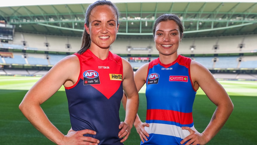 Daisy Pearce and Ellie Blackburn pose for a photo at Marvel Stadium at the AFLW fixture launch for season 2022.