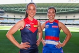 Daisy Pearce and Ellie Blackburn pose for a photo at Marvel Stadium at the AFLW fixture launch for season 2022.