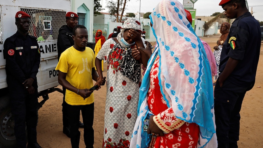 Four men and two women react to news of fatalities at a hospital