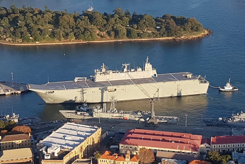 HMAS Adelaide  in the water near Garden Island, Sydney.