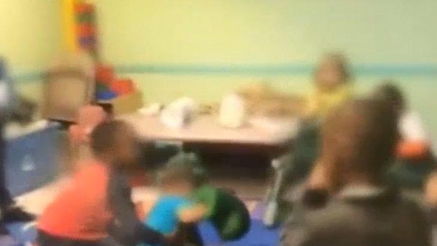 Screenshot from news report showing vision of toddlers punching each other in US daycare centre